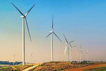 Wall Mural - concept idea eco power energy. wind turbine on hill with sunset