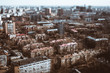 True tilt-shift view from hight point of residential district of consisted of modular prefabricated buildings, five-story block of flats houses of the Khrushchev era in Moscow, Russia; sunny spring