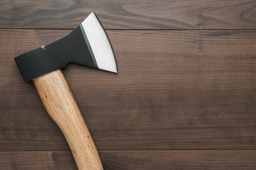 new axe on the wooden table background