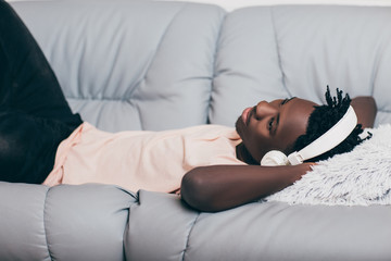 Wall Mural - African-American man in headphones listening to music