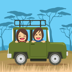 cute young couple on safari tour vacation riding car happy