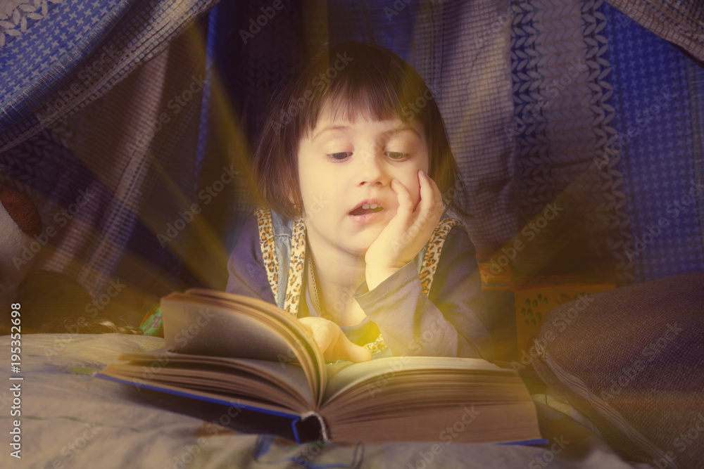 foto-de-stock-cute-little-child-girl-reading-a-book-in-bed-before-going