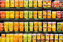 Assortment Of Fresh Cut Fruit In Plastic Containers  In Supermarket Grocery Display Case 