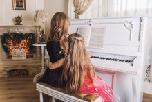 Woman Teach Girl Play Piano