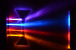 © Kim - Light beams in colorblind-friendly colors pass trough a concave demonstration lens, the influence on the beams can be seen on the screen