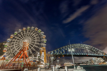 Wall Mural - ferris wheel and harbour bridge in Sydney, Australia by night