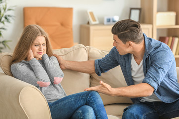 Poster - Young couple in quarrel at home