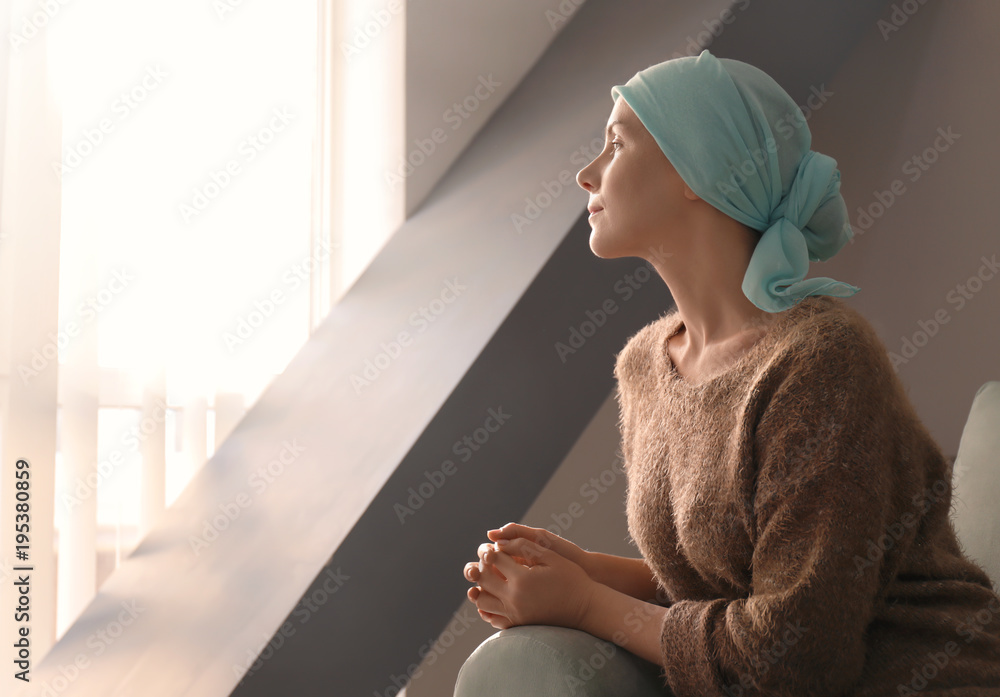 Young woman with cancer in headscarf indoors - obrazy, fototapety, plakaty 