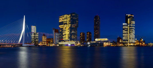 Wall Mural - City Landscape, panorama - Night view on Erasmus Bridge and district Feijenoord city of Rotterdam, The Netherlands.