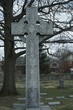 © Tina  - Celtic cross on grave, memorial grave marker carved stone cross in graveyard