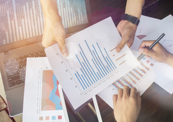 Hands of businesspeople during data discussion at meeting