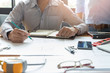 © jat306 - Engineer and Architect concept, Engineer Architects office team working with blueprints