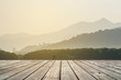 © bigy9950 - Empty wooden terrace with Layers of mountain ridges silhouettes on background