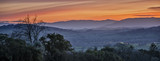 Fototapeta  - The Winter Sun Sets over the Misty Sonoma Valley in Sonoma, California 