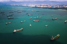 Top View From Airplane Of Singapore Harbor With Transportation Boat And Container Ship