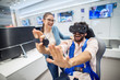 © Dusan Petkovic - Multiracial couple having fun with VR goggles while boy sitting in the chair in the tech store. Customer's service. Shopping time.