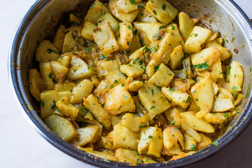 Fried Celery Slices with Parsley in Pan.