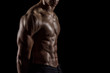 © abdulrahman - Highly retouched chest muscles, six pack abs and triceps. Concept of power and healthcare. Black background.