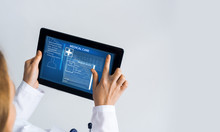Close Of Female Doctor Hands Working With Tablet Pc Computer