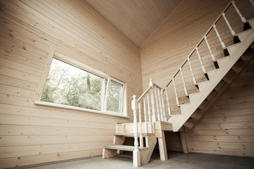 Wall Mural - Empty room interior with wooden stairway