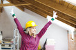 © epiximages - blond, beautiful woman is overjoyed with the idea to expand the loft