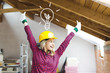 © epiximages - blond, beautiful woman is overjoyed with the idea to expand the loft