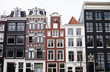 Traditional color contrasted dutch buildings in Amsterdam