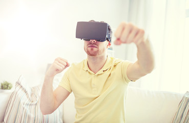 Wall Mural - young man in virtual reality headset or 3d glasses