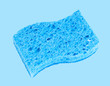 Blue sponge on pastel blue background