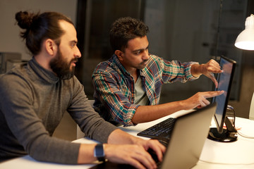 Wall Mural - creative team with computer working late at office