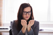 © Andrey Popov - Businesswoman Looking At Her Finger Nails