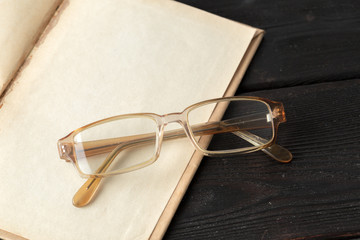 Poster - eyeglasses and book on the table