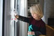 © Wavebreak Media - Boy cleaning window with rag cloth