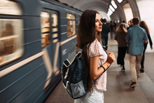 Young Travel Girl With The Bag Back In Russian Metro.
