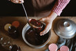 © Pixel Stories/Stocksy - Preparing homemade strawberry jam