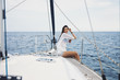 © Lumina/Stocksy - Woman Enjoying Sea on Sailboat