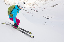 Portrait Of Woman Skiing Downhill Steep Ski Slope