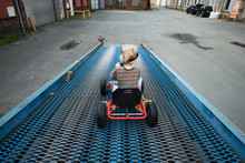 Boy With Children's Pedal Car Toy