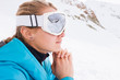 © RG&B Images/Stocksy - Caucasian woman wearing ski goggles mirroring the snowy mountain