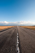 © RG&B Images/Stocksy - One lane empty road with clear blue sky above