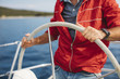 © Lumina/Stocksy - Skipper Navigating Sailboat
