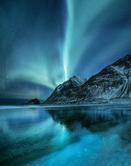 Wall Mural - northen light under mountains. beautiful natural landscape in the norway