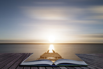 Wall Mural - Creative book image of Beautiful vibrant sunset landscape image of Fleet Lagoon in Dorset England