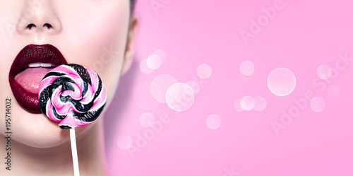 Sexy beauty girl eating lollipop Tableau sur Toile