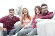 © ASDF - group of happy young people sitting on the couch