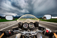 Biker On A Motorcycle Hurtling Down The Road In A Lightning Storm - Forggensee And Schwangau, Germany Bavaria