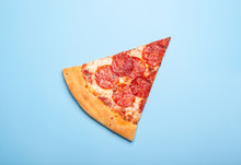 Slice Of Delicious Pizza Pepperoni Isolated On Blue Background