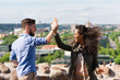 © Roman Babakin - Young smiling multiracial couple clapping their hands Lithuania