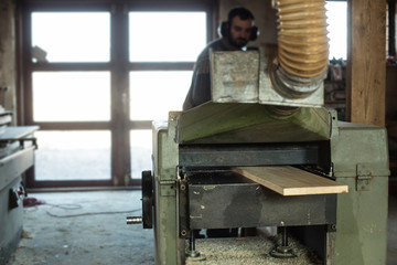 Wall Mural - Carpenter using electric saw
