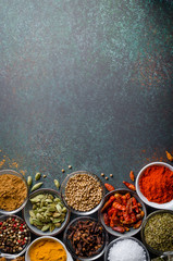 Various spices in glass bowls